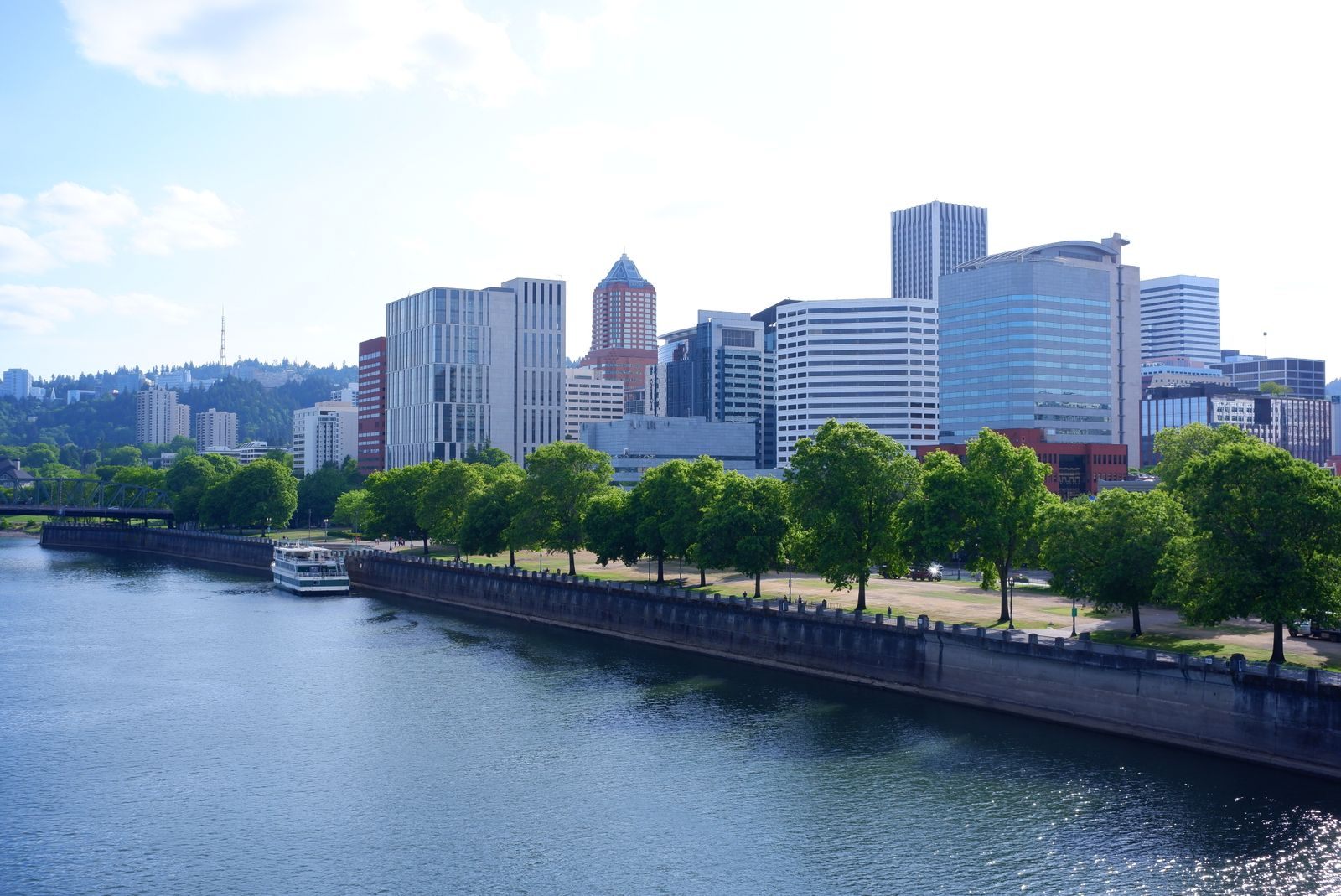 Downtown Portland skyline above the Willamette River and its waterfront park, where Columbia river cruise Portland departures begin